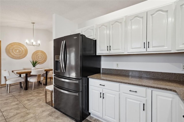 2135 Lake View Ridge Dr NE, Solon, IA 52333 - kitchen featuring fridge with ice dispenser, white cabinetry, a chandelier, decorative light fixtures, and light tile patterned floors