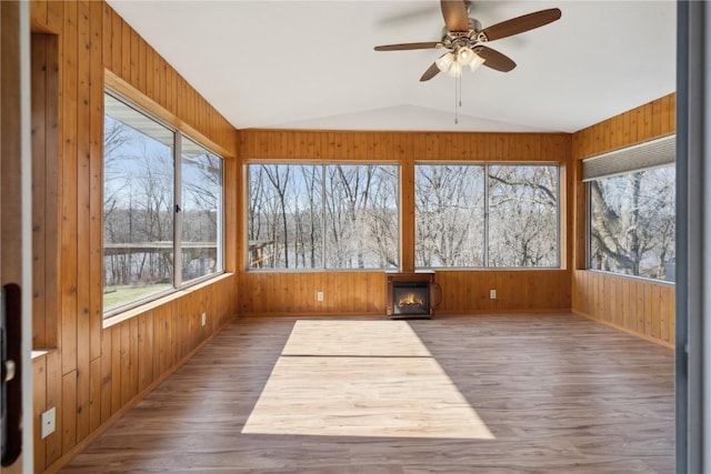 2135 Lake View Ridge Dr NE, Solon, IA 52333 - unfurnished sunroom featuring wooden walls, wood finished floors, and vaulted ceiling