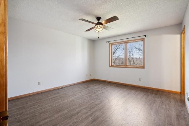 2135 Lake View Ridge Dr NE, Solon, IA 52333 - unfurnished room with wood finished floors, a textured ceiling, and a ceiling fan