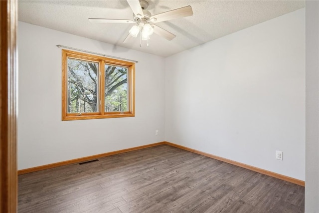 2135 Lake View Ridge Dr NE, Solon, IA 52333 - unfurnished room featuring wood finished floors, a textured ceiling, and ceiling fan