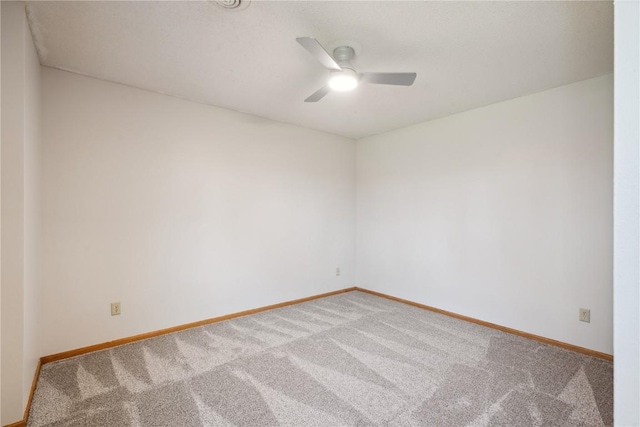 2135 Lake View Ridge Dr NE, Solon, IA 52333 - carpeted empty room with ceiling fan and baseboards