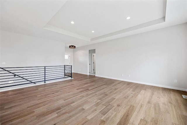 226 Mccarran Ave NE, Cedar Rapids, IA 52402 - unfurnished room featuring a raised ceiling, wood finished floors, and recessed lighting
