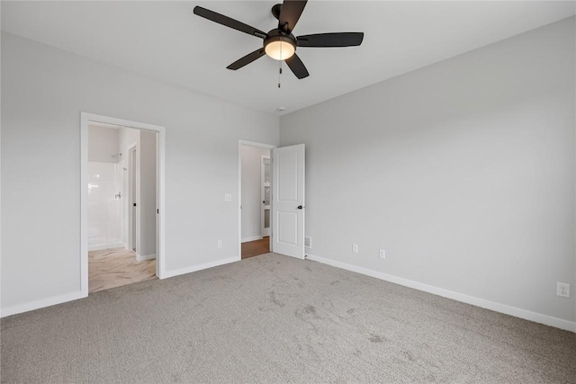 226 Mccarran Ave NE, Cedar Rapids, IA 52402 - unfurnished bedroom with carpet floors, ensuite bath, and a ceiling fan