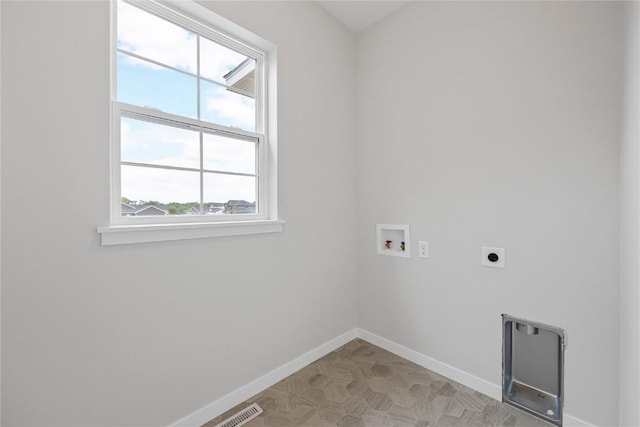 226 Mccarran Ave NE, Cedar Rapids, IA 52402 - laundry area featuring healthy amount of natural light, electric dryer hookup, washer hookup, and heating unit