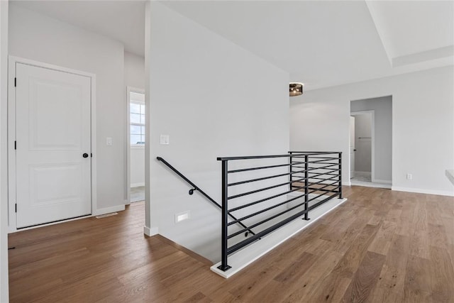 226 Mccarran Ave NE, Cedar Rapids, IA 52402 - hallway featuring an upstairs landing and wood finished floors