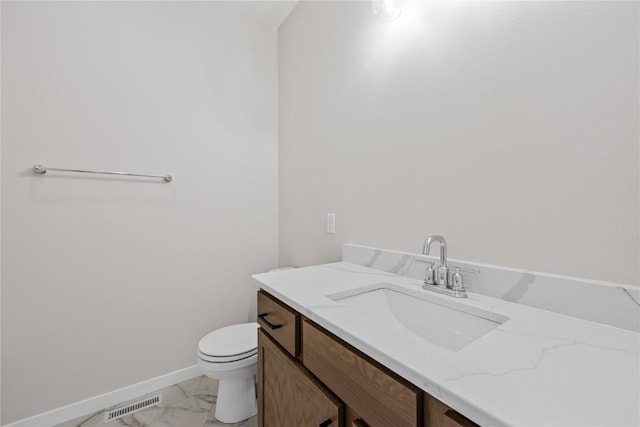 226 Mccarran Ave NE, Cedar Rapids, IA 52402 - bathroom featuring vanity and marble look tile flooring