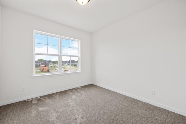 226 Mccarran Ave NE, Cedar Rapids, IA 52402 - carpeted empty room with baseboards