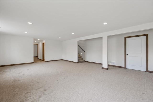 226 Mccarran Ave NE, Cedar Rapids, IA 52402 - finished below grade area with recessed lighting, stairs, and light colored carpet