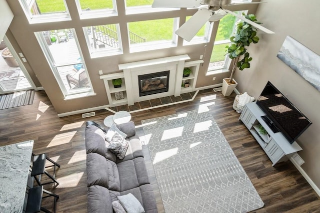 2654 Mulberry Ct, Marion, IA 52302 - living room with wood finished floors, ceiling fan, and a fireplace