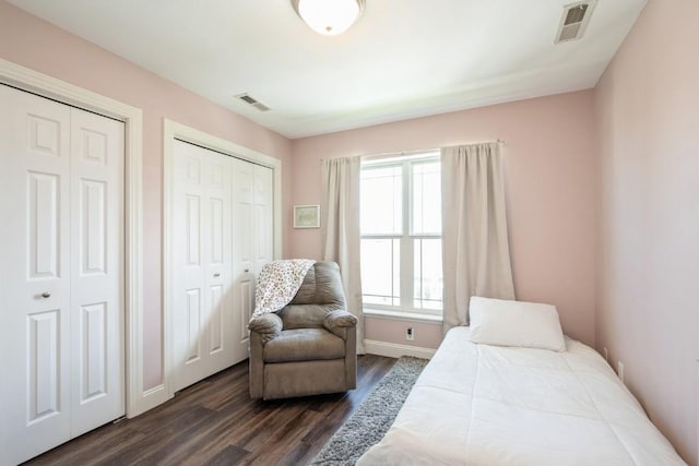 2654 Mulberry Ct, Marion, IA 52302 - bedroom featuring multiple closets and dark wood finished floors