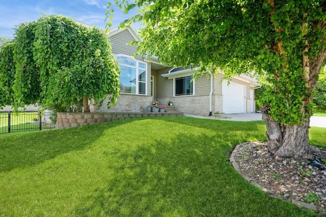 2654 Mulberry Ct, Marion, IA 52302 - view of property hidden behind natural elements with brick siding and an attached garage