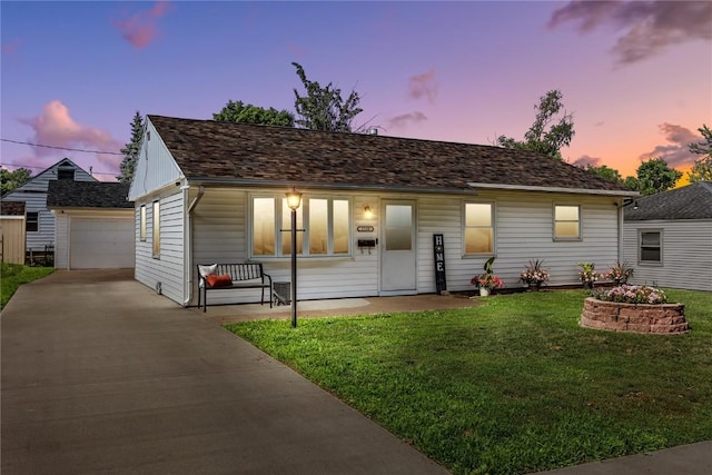 1140 31st St, Cedar Rapids, IA 52402 - ranch-style house featuring an outbuilding, a front lawn, and concrete driveway