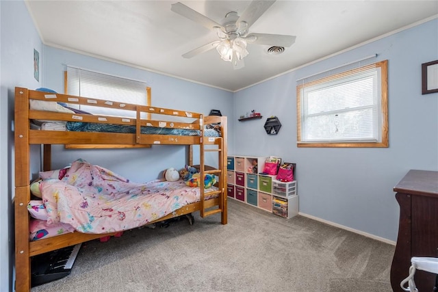 1140 31st St, Cedar Rapids, IA 52402 - carpeted bedroom with crown molding and ceiling fan