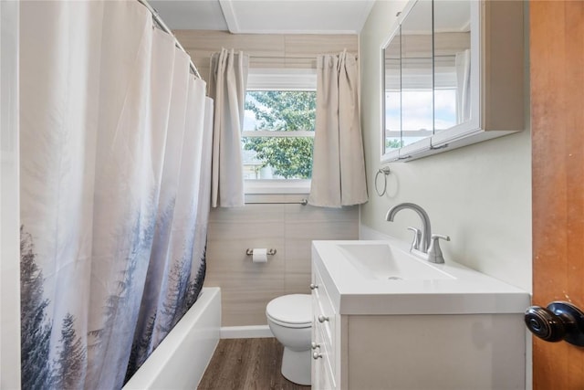 1140 31st St, Cedar Rapids, IA 52402 - full bathroom with vanity, wood finished floors, shower / tub combo with curtain, and tile walls