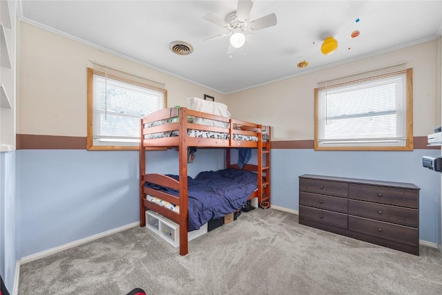 1140 31st St, Cedar Rapids, IA 52402 - carpeted bedroom featuring ornamental molding and ceiling fan