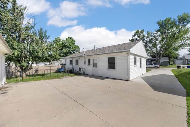 1140 31st St, Cedar Rapids, IA 52402 - rear view of house with a patio area and driveway
