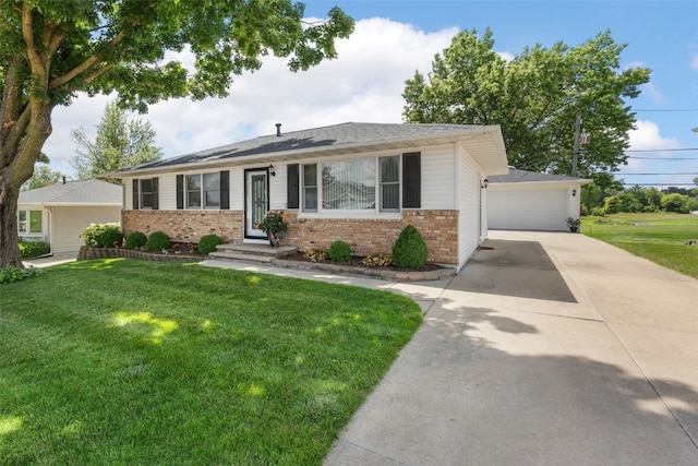 906 29th St NW, Cedar Rapids, IA 52405 - ranch-style home featuring brick siding, a front lawn, and a garage