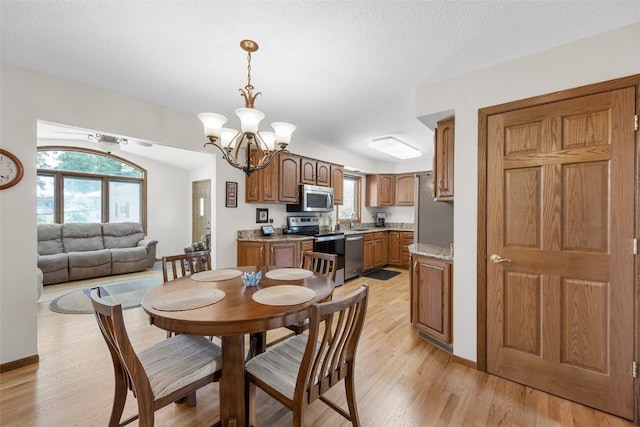 906 29th St NW, Cedar Rapids, IA 52405 - dining space with a chandelier and light wood-type flooring