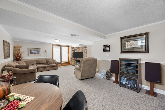 906 29th St NW, Cedar Rapids, IA 52405 - living room with a textured ceiling, ornamental molding, carpet floors, and a fireplace