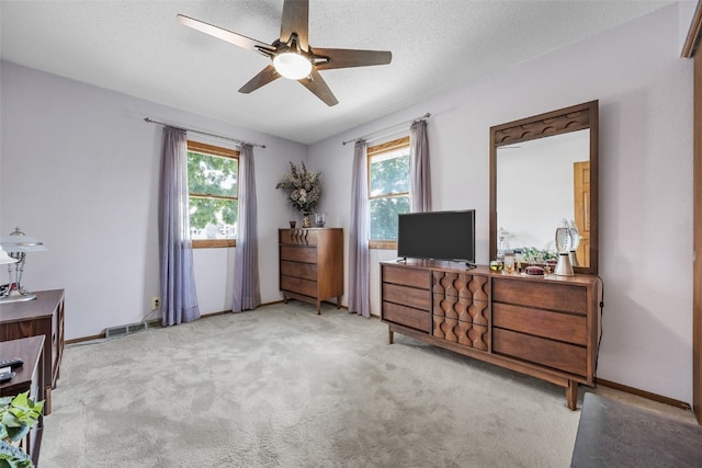 906 29th St NW, Cedar Rapids, IA 52405 - bedroom featuring multiple windows, carpet floors, and ceiling fan