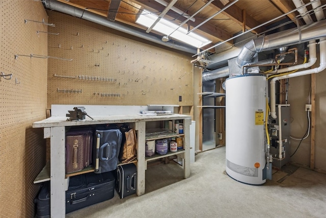 906 29th St NW, Cedar Rapids, IA 52405 - basement featuring a workshop area, gas water heater, and carpet