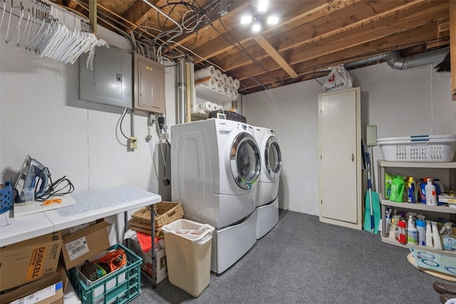 906 29th St NW, Cedar Rapids, IA 52405 - laundry room with electric panel, washing machine and dryer, and carpet flooring