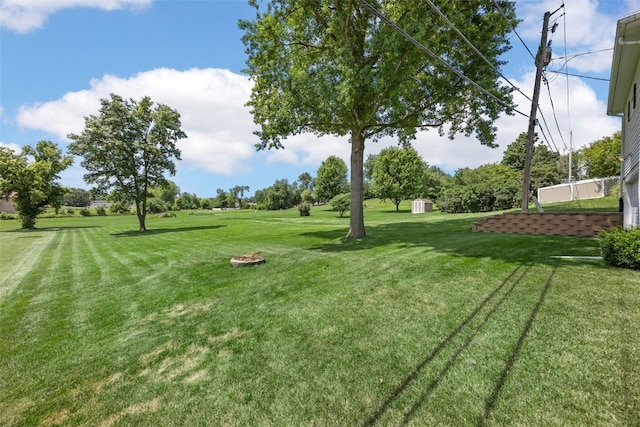 906 29th St NW, Cedar Rapids, IA 52405 - view of grassy yard featuring a storage shed