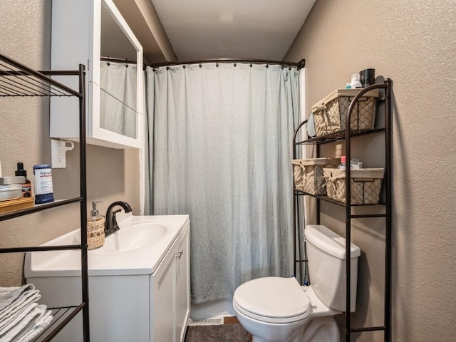 1 E Jefferson Ave S, Urbana, IA 52345 - full bathroom featuring a textured wall, vanity, and a shower with curtain