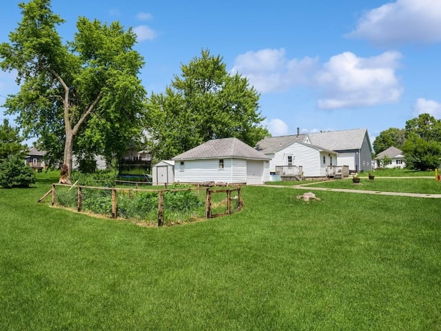 1 E Jefferson Ave S, Urbana, IA 52345 - view of grassy yard featuring a shed