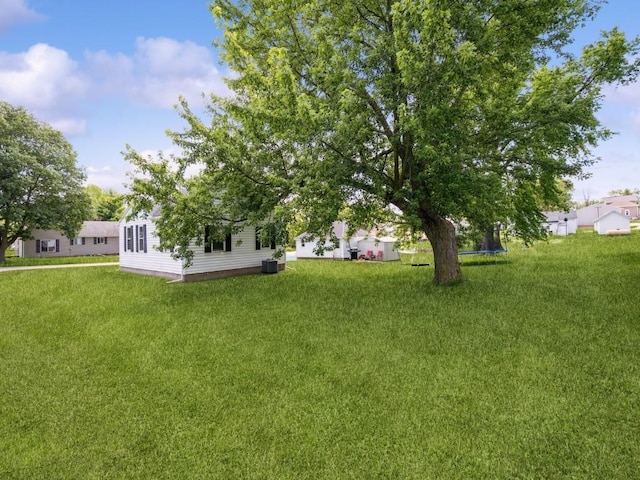 1 E Jefferson Ave S, Urbana, IA 52345 - view of green lawn with a trampoline