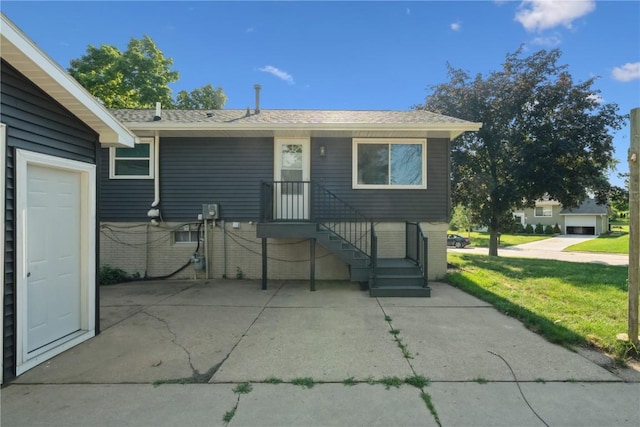 3140 Stratford Ln SW, Cedar Rapids, IA 52404 - view of front of home with brick siding, a front yard, and roof with shingles
