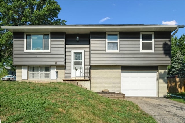 3140 Stratford Ln SW, Cedar Rapids, IA 52404 - split foyer home featuring brick siding, a front yard, a garage, and entry steps