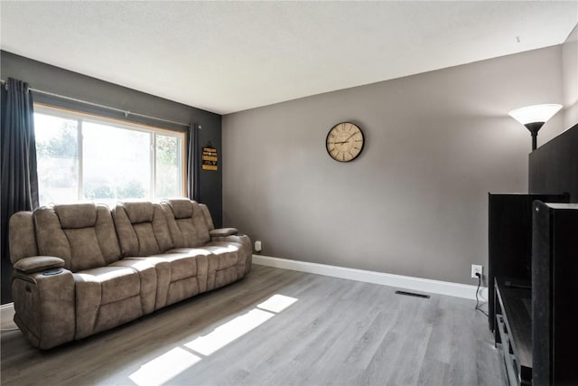 3140 Stratford Ln SW, Cedar Rapids, IA 52404 - living area featuring wood finished floors and baseboards