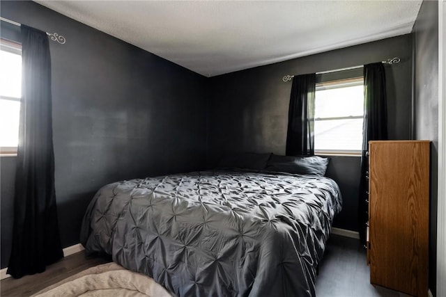 3140 Stratford Ln SW, Cedar Rapids, IA 52404 - bedroom featuring multiple windows and wood finished floors