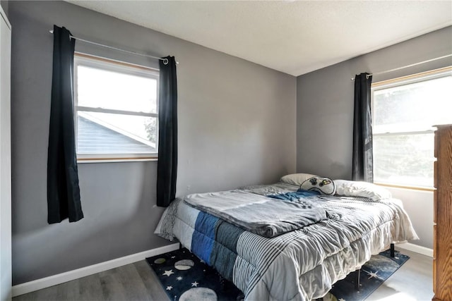 3140 Stratford Ln SW, Cedar Rapids, IA 52404 - bedroom with baseboards and wood finished floors