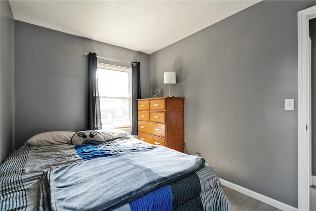 3140 Stratford Ln SW, Cedar Rapids, IA 52404 - bedroom featuring wood finished floors and baseboards
