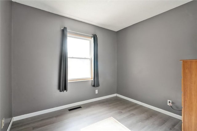 3140 Stratford Ln SW, Cedar Rapids, IA 52404 - unfurnished room featuring wood finished floors and baseboards