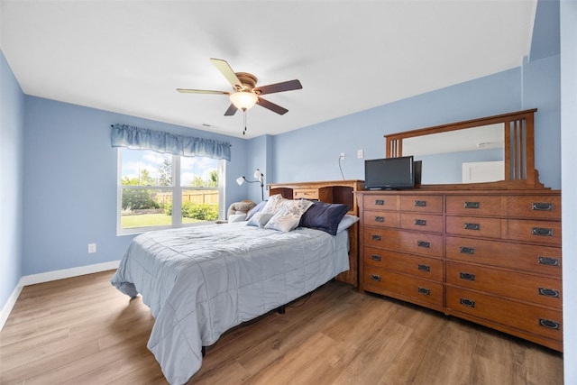 605 Alexis Ln, Marion, IA 52302 - bedroom with light wood-style floors and a ceiling fan
