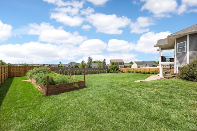 605 Alexis Ln, Marion, IA 52302 - fenced backyard with a garden, a residential view, and a patio area