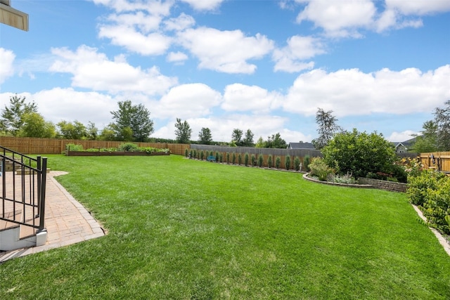 605 Alexis Ln, Marion, IA 52302 - fenced backyard featuring a patio area
