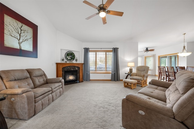 6845 Flint Rock Ct, Marion, IA 52302 - living room with ceiling fan, carpet flooring, plenty of natural light, a high end fireplace, and lofted ceiling