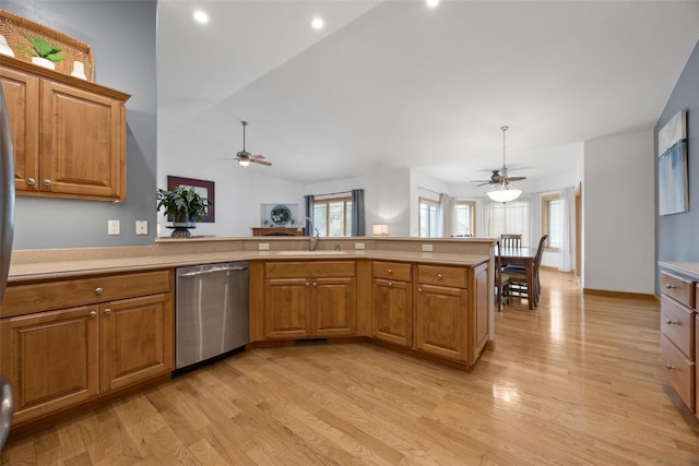 6845 Flint Rock Ct, Marion, IA 52302 - kitchen with stainless steel dishwasher, a ceiling fan, light wood-style flooring, and light countertops