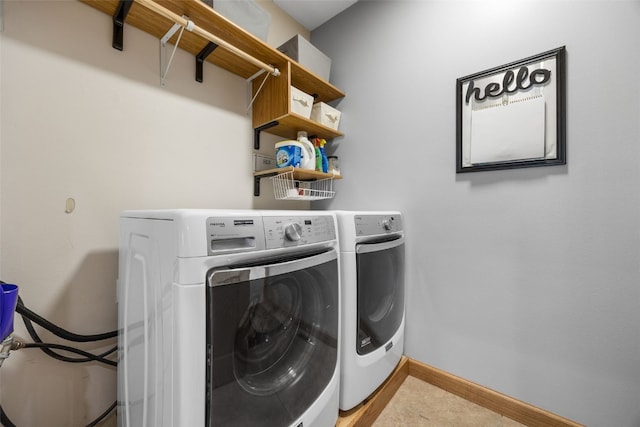 6845 Flint Rock Ct, Marion, IA 52302 - washroom with baseboards and washing machine and clothes dryer