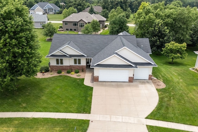 6845 Flint Rock Ct, Marion, IA 52302 - view of front of property featuring an attached garage, a shingled roof, brick siding, concrete driveway, and a front yard