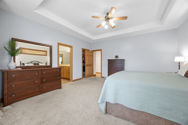 6845 Flint Rock Ct, Marion, IA 52302 - bedroom with a raised ceiling, light colored carpet, ceiling fan, and connected bathroom