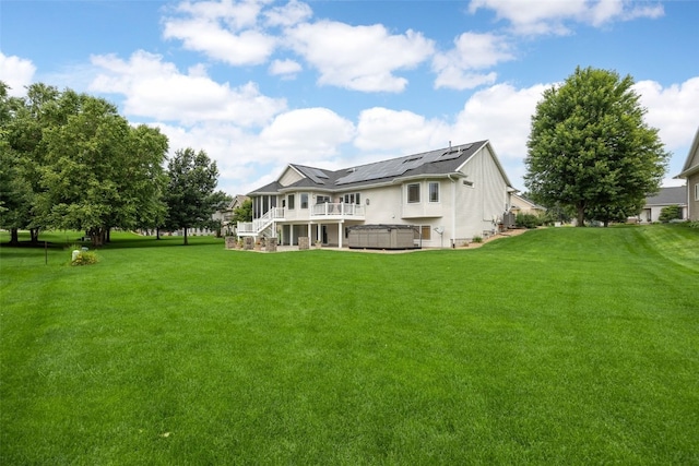 6845 Flint Rock Ct, Marion, IA 52302 - rear view of property featuring a hot tub, stairs, a lawn, and a deck