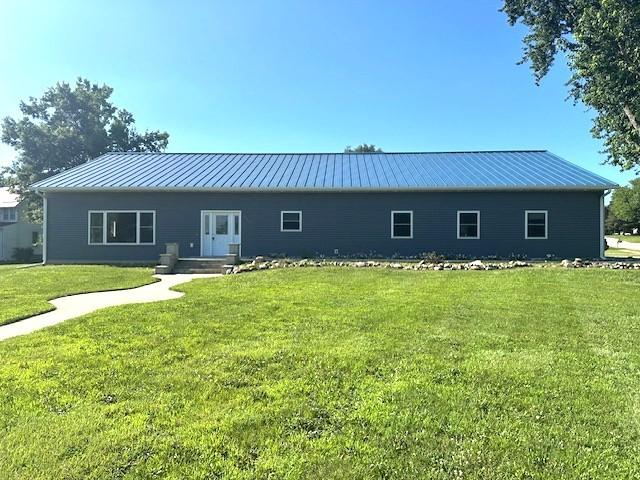 832 E Main St, Central City, IA 52214 - rear view of house with a yard and a metal roof