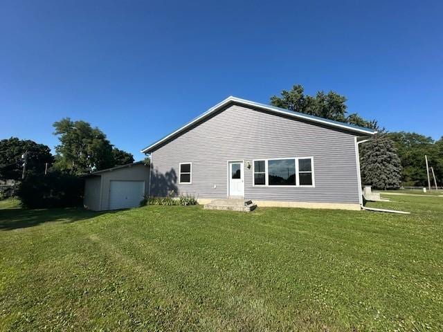 832 E Main St, Central City, IA 52214 - rear view of property with a lawn and a garage
