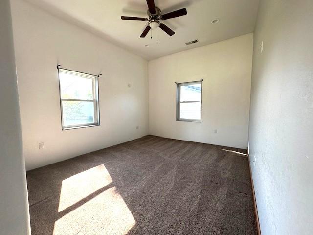 832 E Main St, Central City, IA 52214 - empty room featuring carpet flooring and ceiling fan