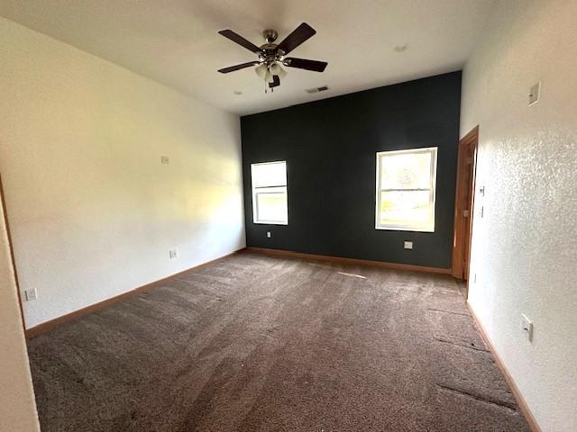 832 E Main St, Central City, IA 52214 - unfurnished room featuring carpet flooring and ceiling fan